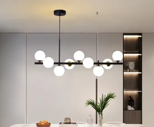 Gaborone pendant light with opal glass globe shades and modern black linear frame above a dining table