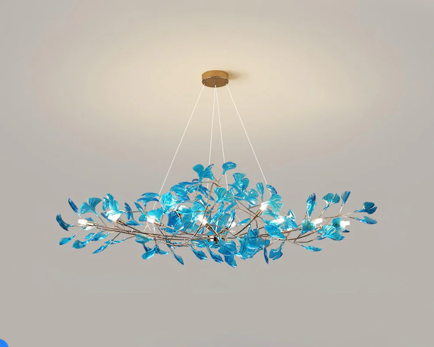 Douglas pendant light with blue acrylic leaf design and integrated LED lighting suspended from the ceiling