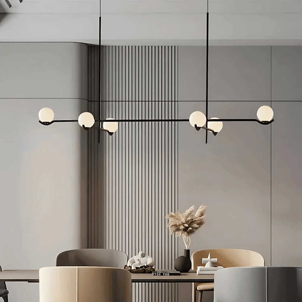 Modern Buenos Aires chandelier with black metal arms and frosted glass globes above a minimalist dining room