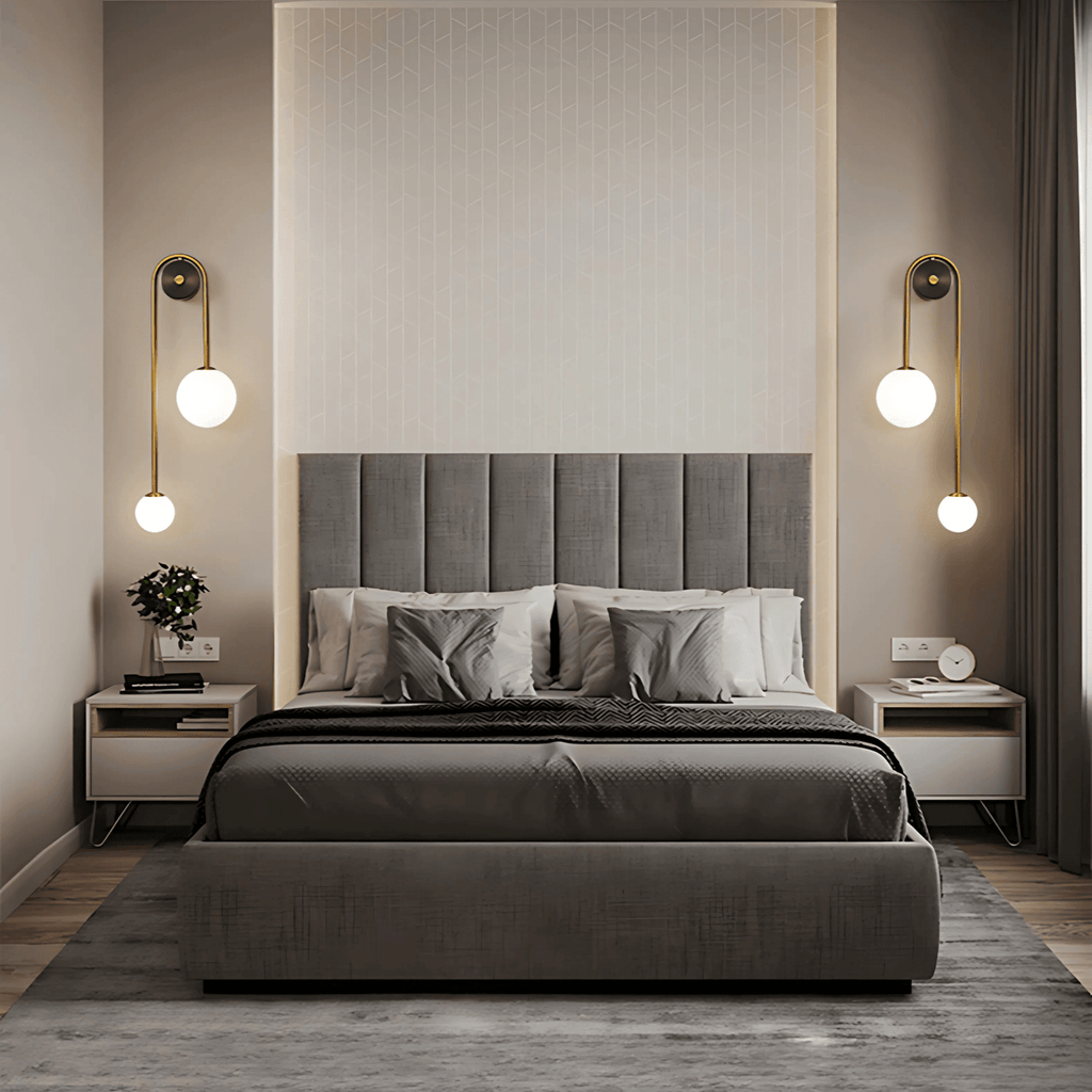 Modern bedroom with Kyoto wall lights in brushed brass and frosted glass globes above bedside tables