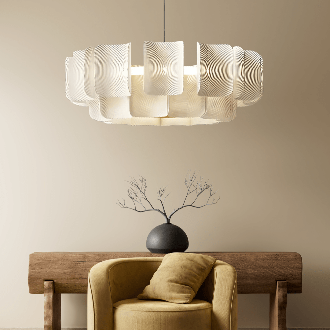 Manila chandelier modern acrylic LED pendant light above a chair and wooden console table