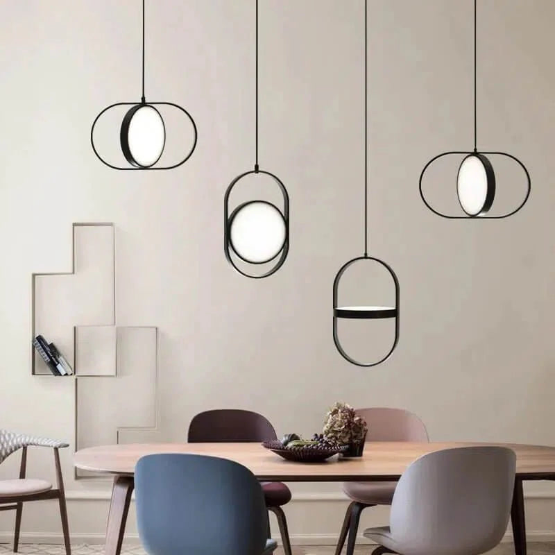 Modern Washington DC pendant light with black metal frame and glowing acrylic LED shade above a dining table