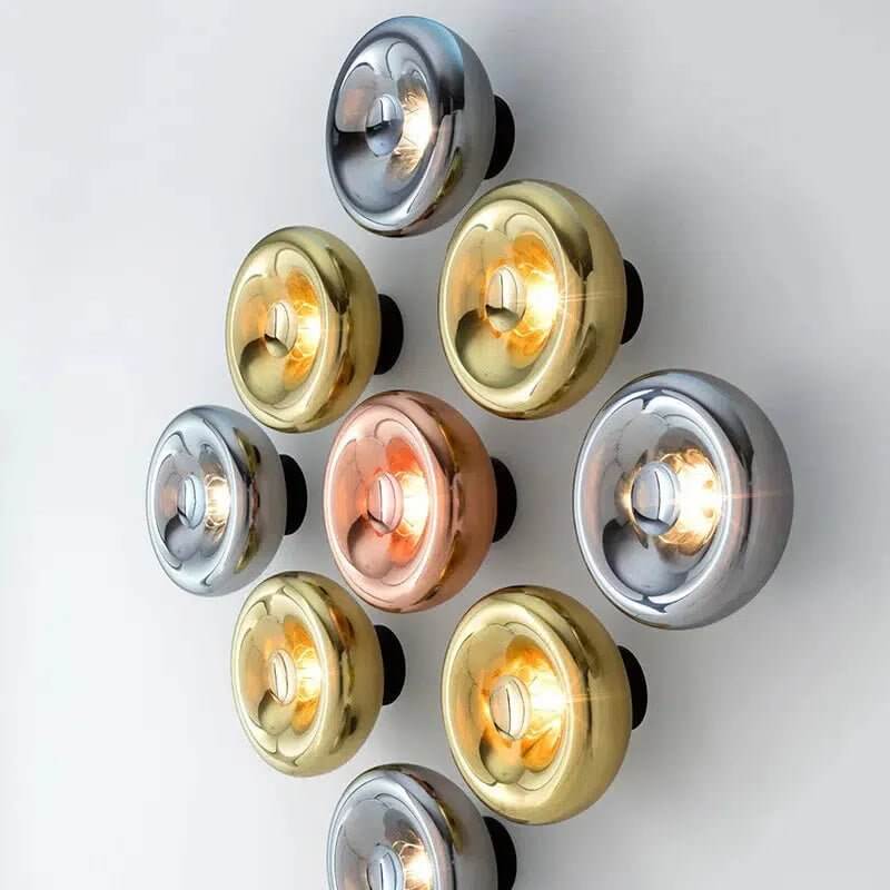 Edinburgh wall light cluster in gold, silver and rose gold finishes with glowing glass shades