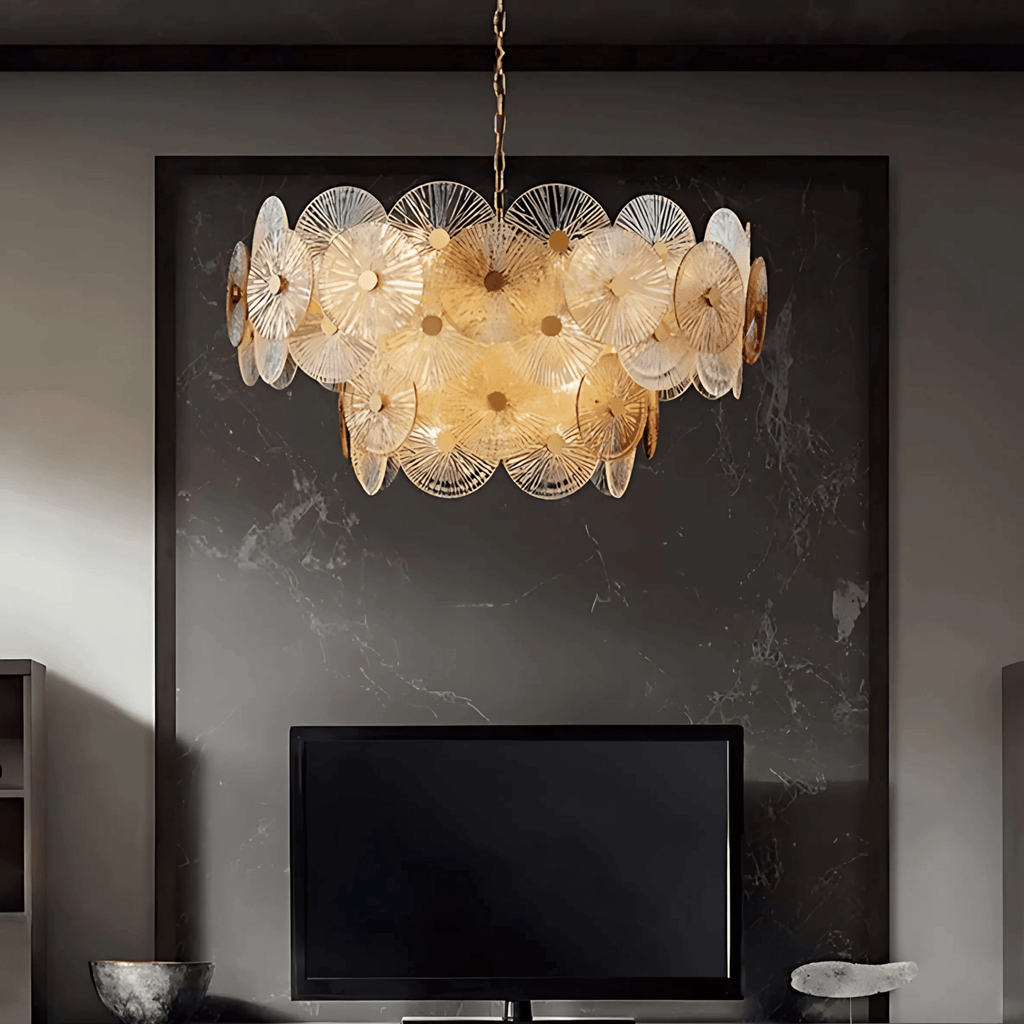 Paris chandelier with layered ribbed glass discs and warm light above a modern fireplace wall