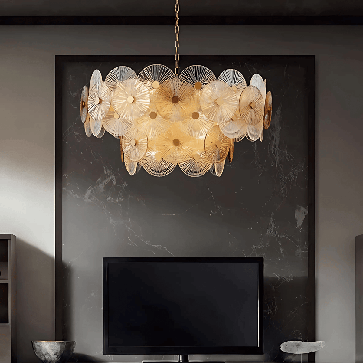 Paris chandelier with layered ribbed glass discs and warm light above a modern fireplace wall
