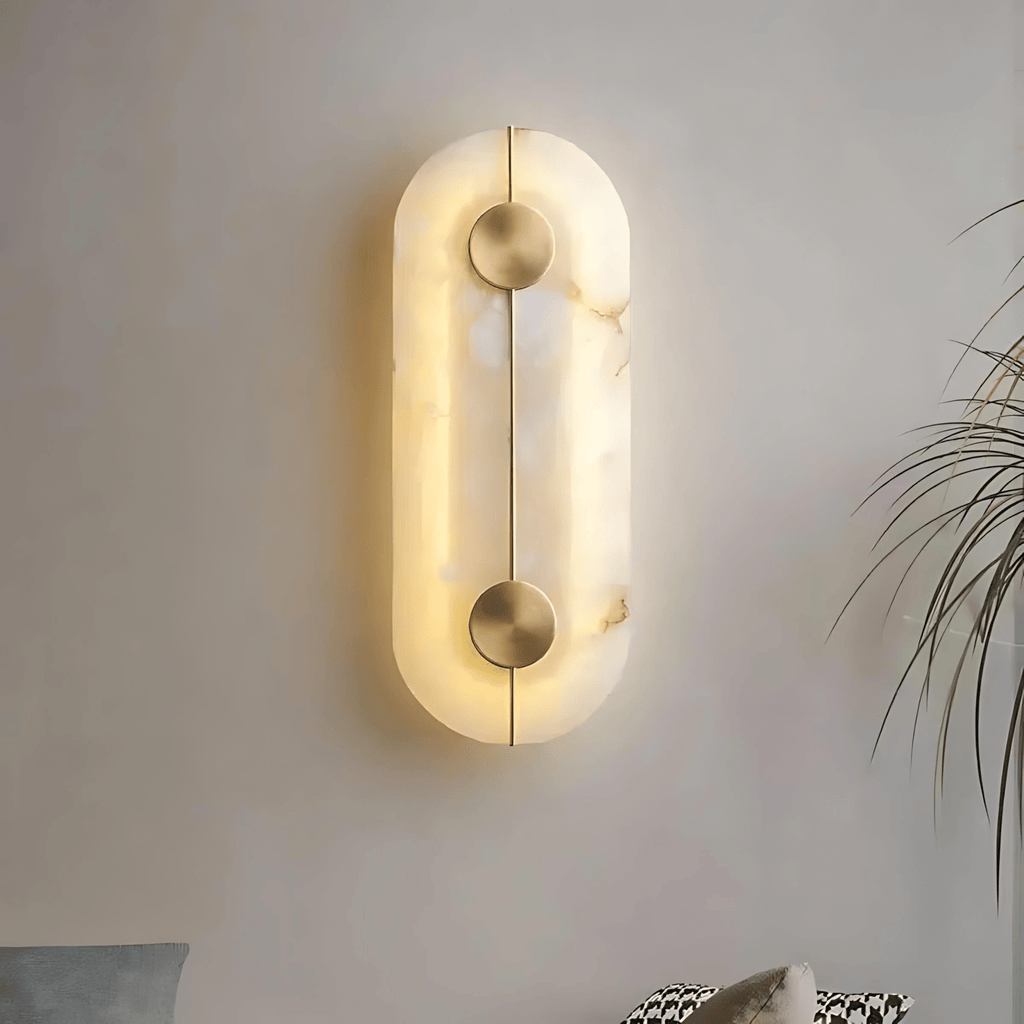 Oslo wall light in metal and natural stone with integrated LED glow mounted on a modern interior wall