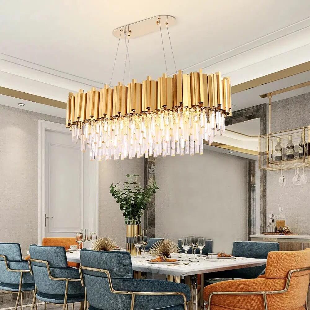 Bogotá crystal chandelier in gold metal with hanging crystal rods above a modern dining table