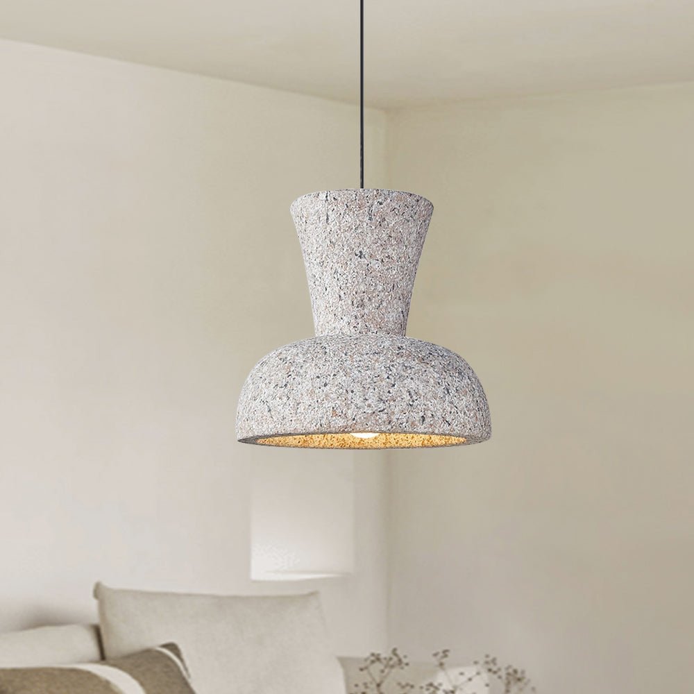 Melbourne pendant light with textured resin bell shade in modern Japandi style hanging in a neutral bedroom